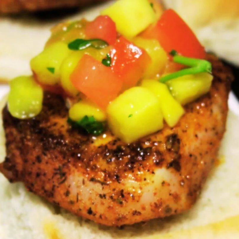 Pan seared fish topped with mango salsa.