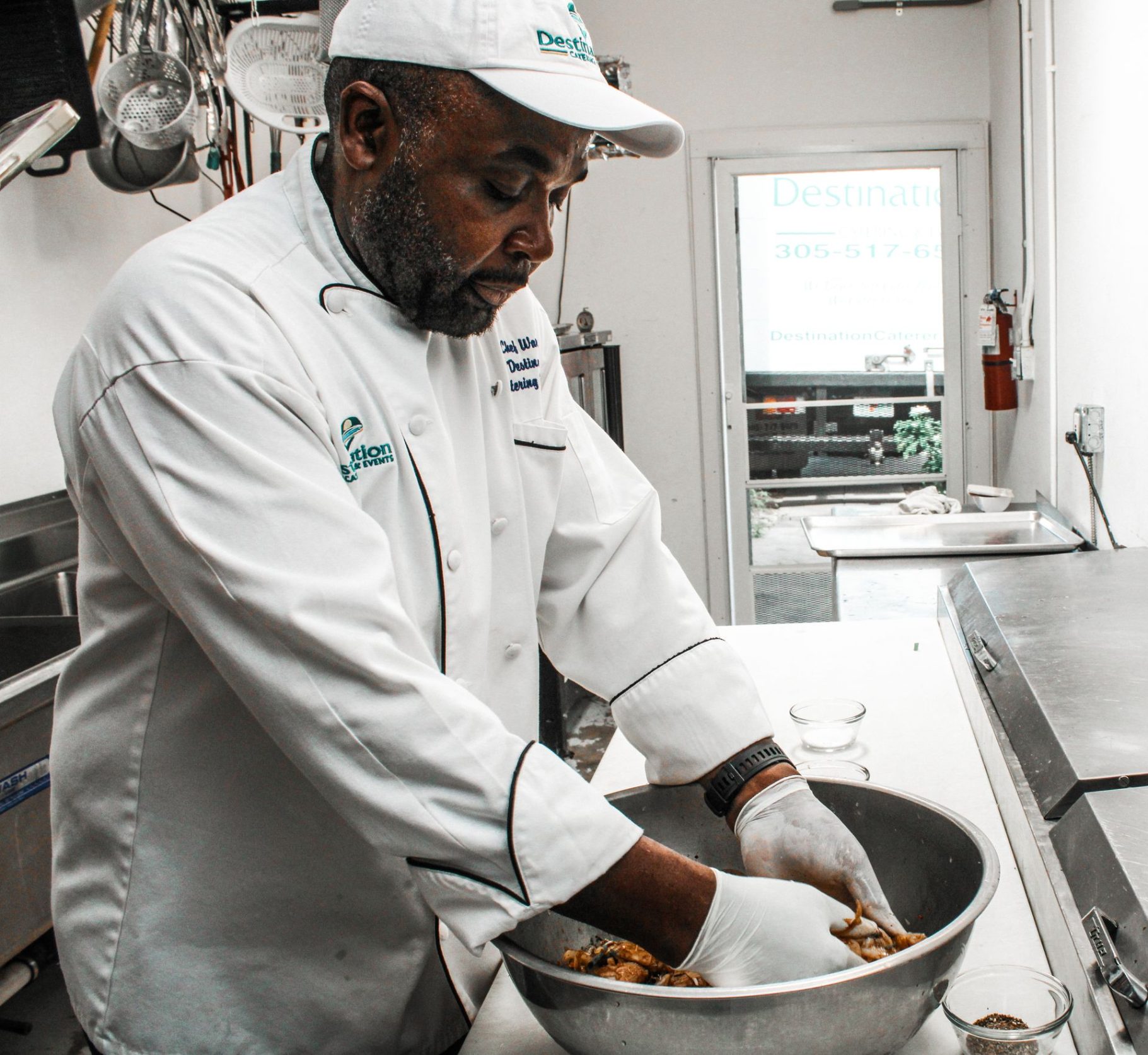 Meet The Chef. Chef Warren mixes ingredients for a Jerk marinade.