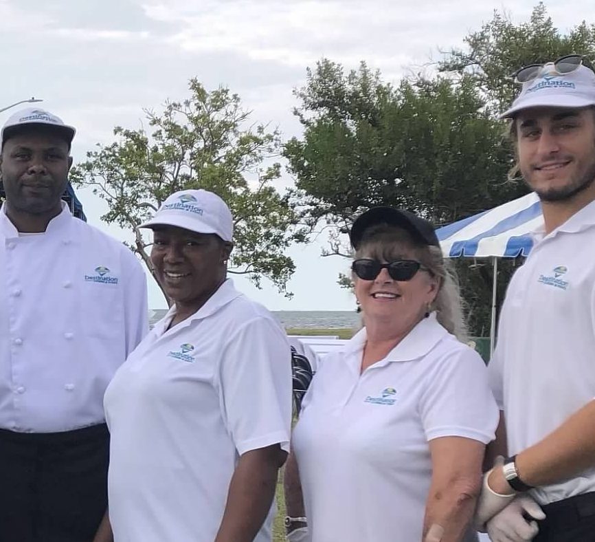 Team Members Destination Catering & Events' team members ready for service, shore side on the Navy Base, Key West.