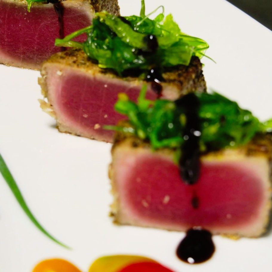 Sliced rare tuna topped with seaweed salad and a drizzle of Keylime Ponzu sauce.